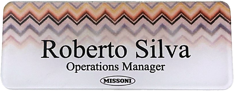 Clear acrylic name tag with a printed zigzag pattern, name and title