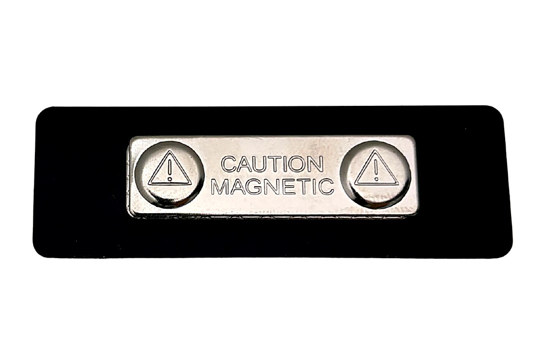 Black protective backing on a clear acrylic name tag