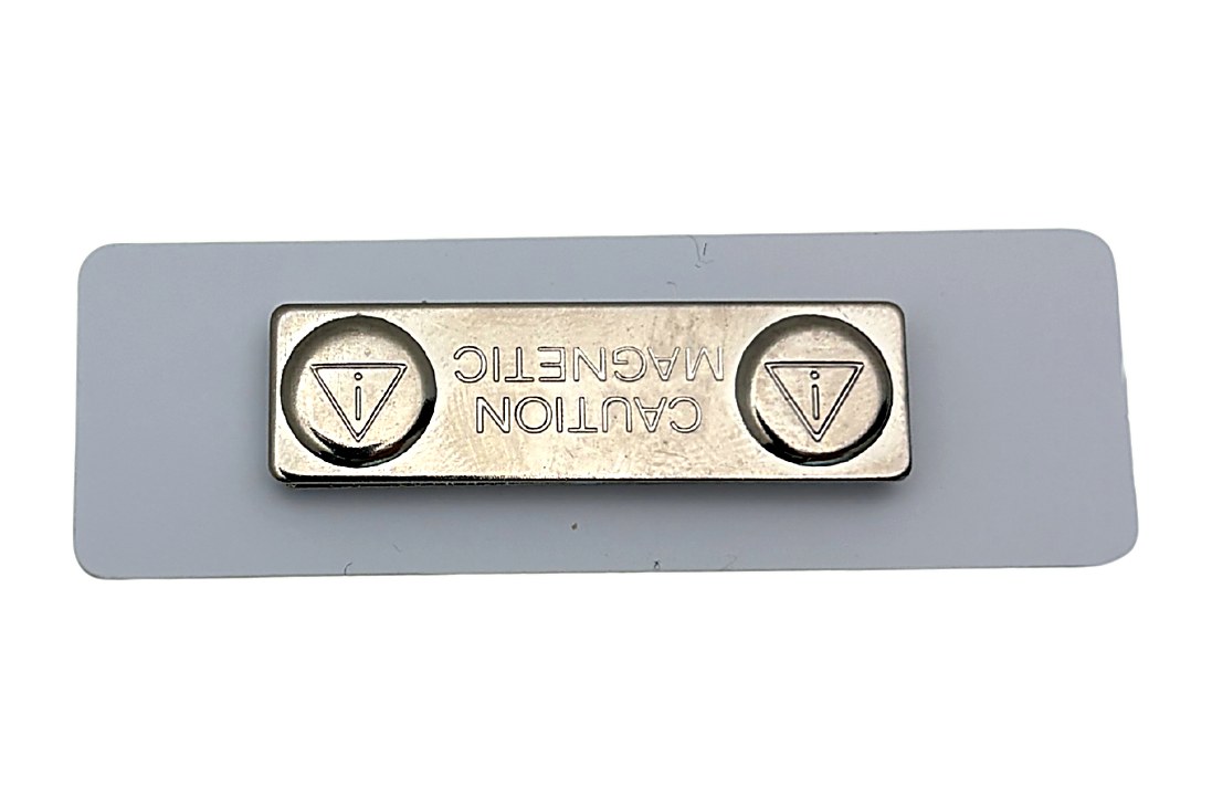 White protective backing on a clear acrylic name tag