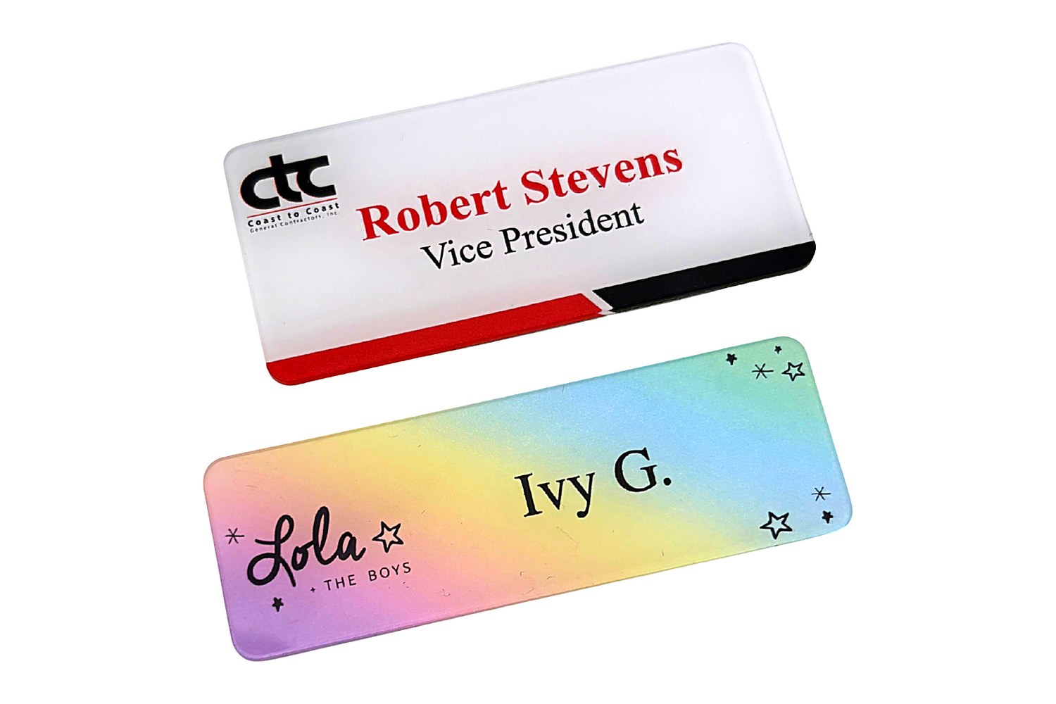 Two clear acrylic name tags: a white-base corporate tag and a pastel gradient tag